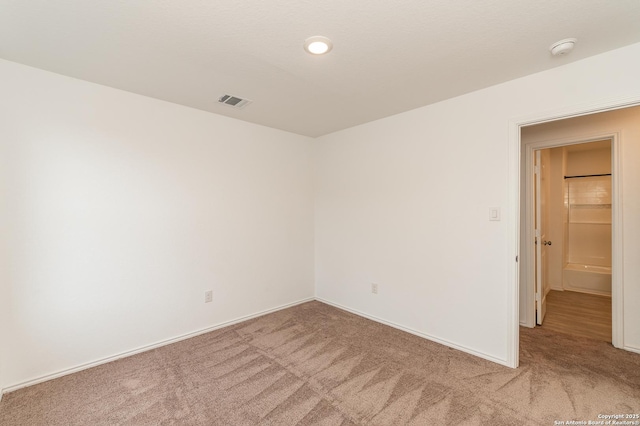 empty room with carpet flooring