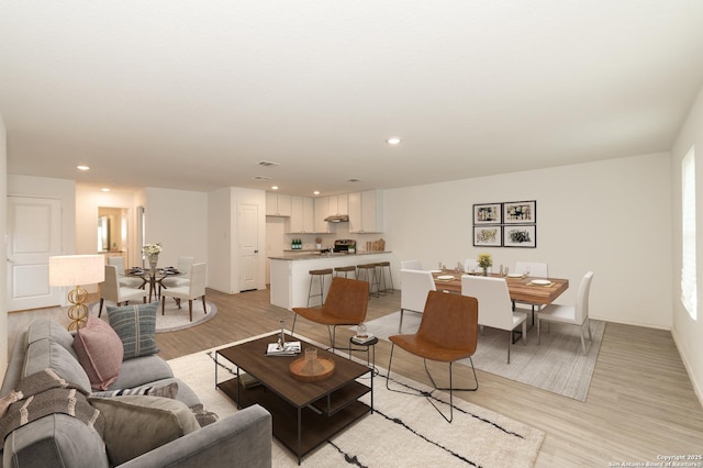 living room with light hardwood / wood-style floors