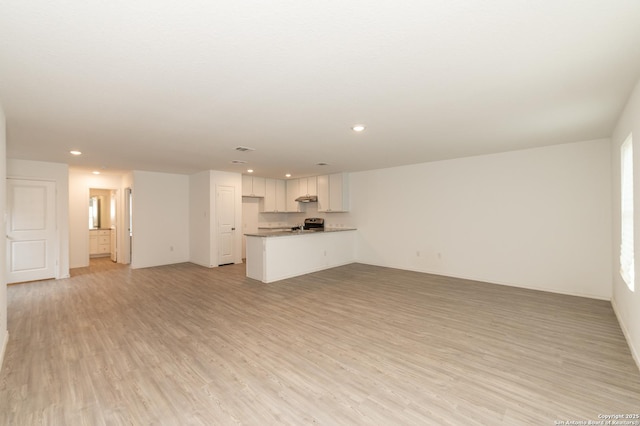 unfurnished living room with light wood-type flooring