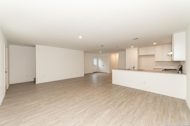 interior space with sink and light hardwood / wood-style floors