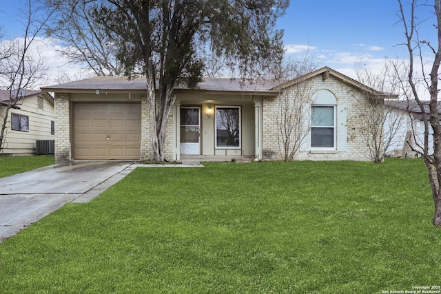 ranch-style home featuring a garage, central AC unit, and a front lawn