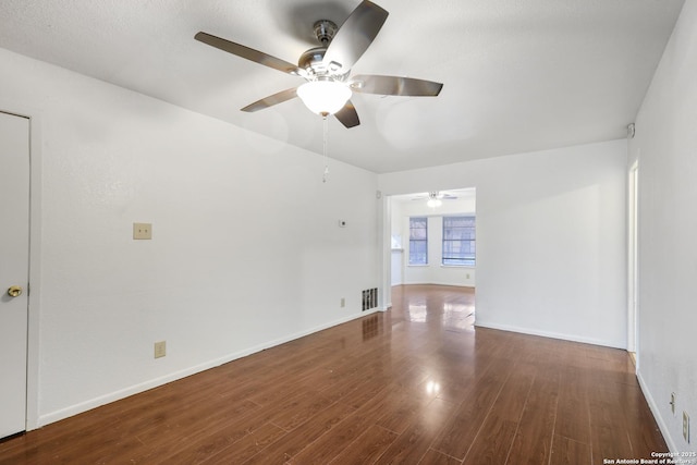 unfurnished room featuring dark hardwood / wood-style flooring