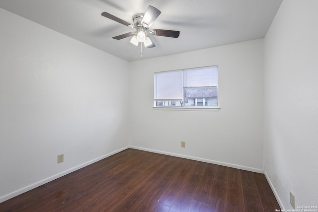 unfurnished room featuring dark wood-type flooring and ceiling fan