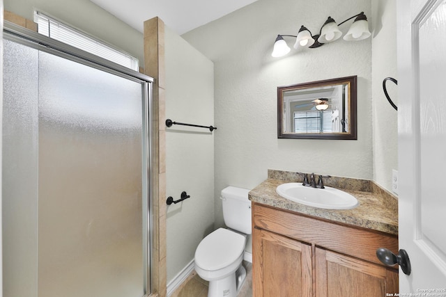 bathroom featuring vanity, walk in shower, and toilet