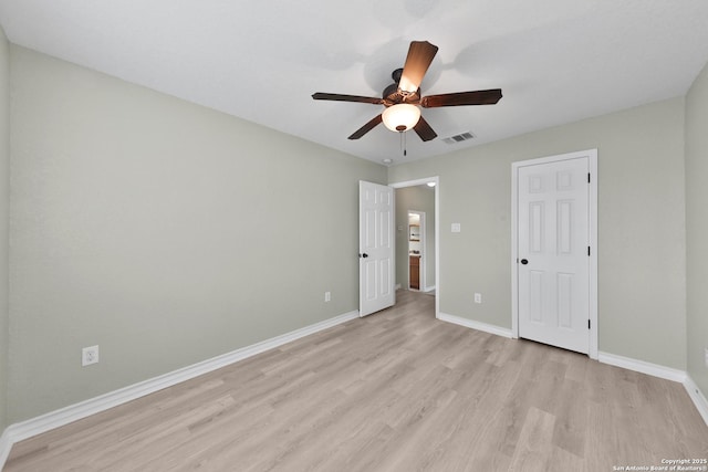 unfurnished bedroom with ceiling fan and light wood-type flooring