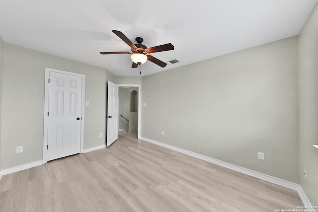 unfurnished bedroom with ceiling fan and light wood-type flooring