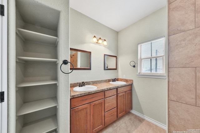 bathroom with tile patterned flooring and vanity