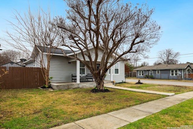 bungalow-style house with a front yard