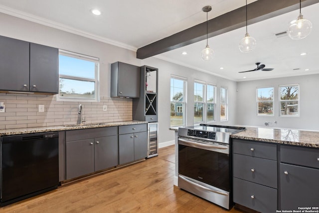 kitchen with black dishwasher, sink, electric range, and light stone counters