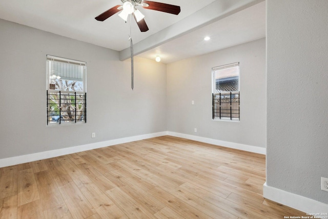 empty room with ceiling fan and light wood-type flooring