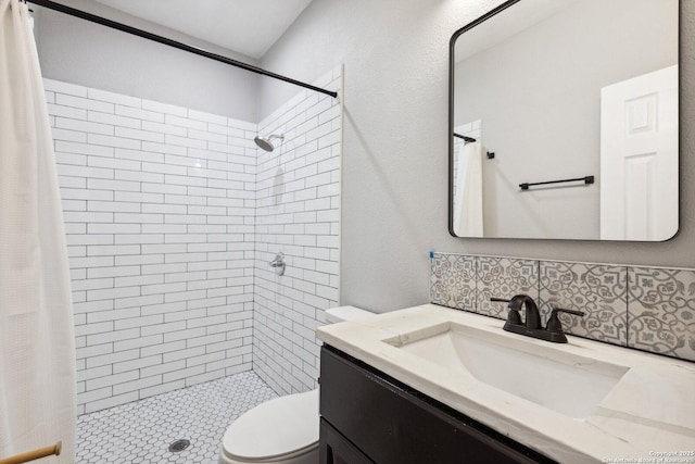 bathroom featuring vanity, toilet, curtained shower, and decorative backsplash