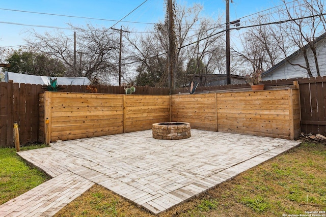 view of patio / terrace featuring a fire pit