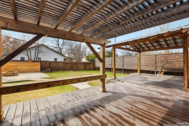 wooden terrace featuring a lawn and a pergola