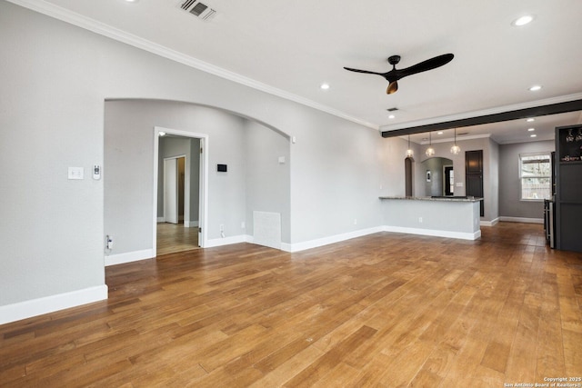 unfurnished living room featuring crown molding, ceiling fan, and light hardwood / wood-style flooring