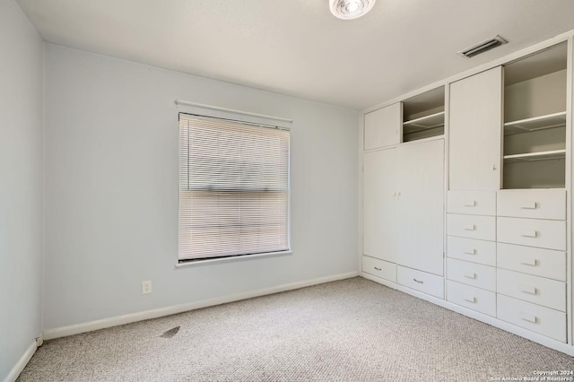 unfurnished bedroom with carpet flooring