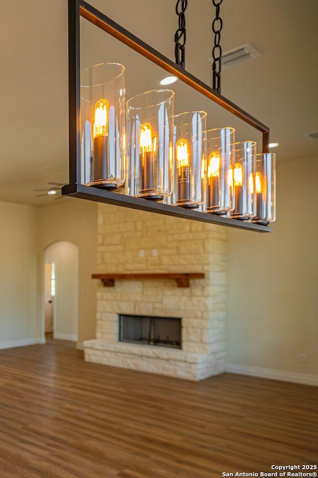 unfurnished living room featuring hardwood / wood-style flooring and a fireplace