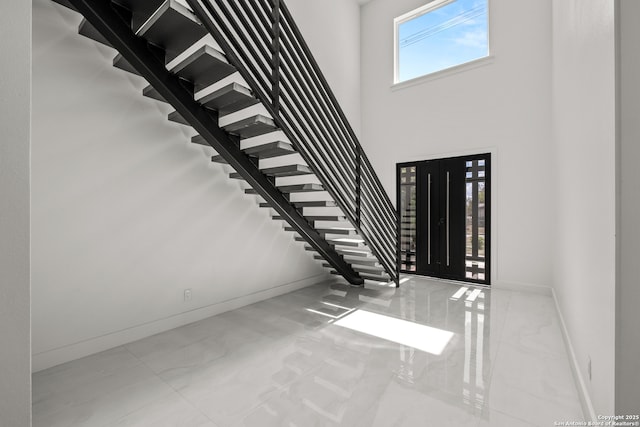 entrance foyer with a towering ceiling