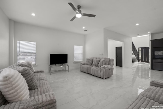 living room featuring ceiling fan