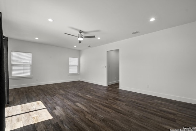 unfurnished room with ceiling fan and dark hardwood / wood-style floors