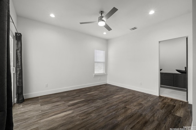 unfurnished bedroom with ceiling fan and dark hardwood / wood-style flooring