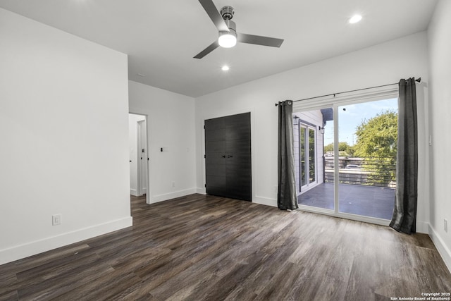 interior space with dark wood-type flooring and ceiling fan