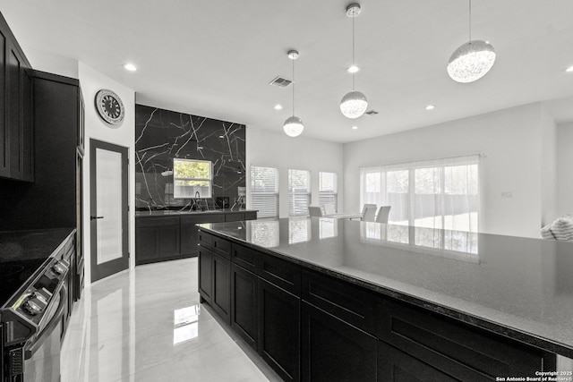 kitchen with sink, decorative light fixtures, and black range with electric cooktop