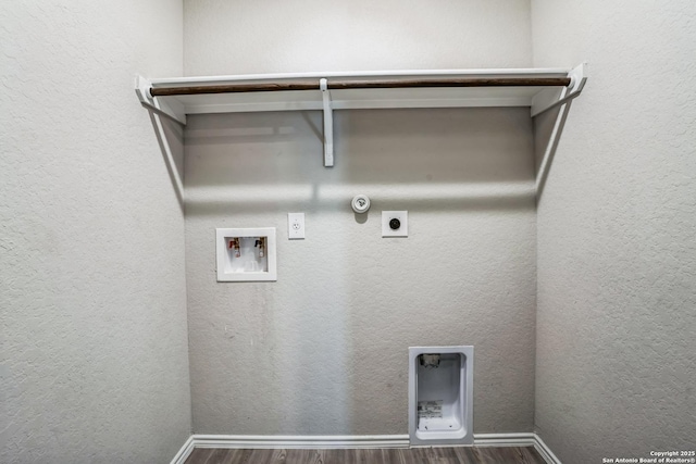 laundry area with dark wood-type flooring, hookup for a gas dryer, hookup for a washing machine, and electric dryer hookup