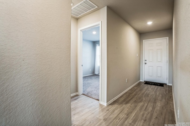 corridor featuring hardwood / wood-style flooring