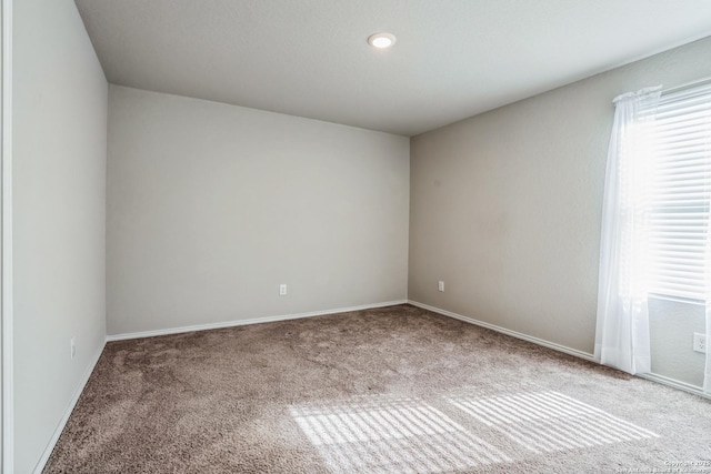 view of carpeted spare room