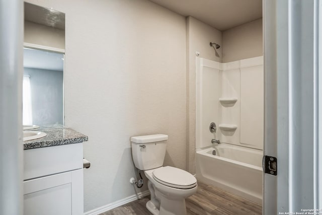 full bathroom featuring hardwood / wood-style flooring, vanity, shower / bathtub combination, and toilet