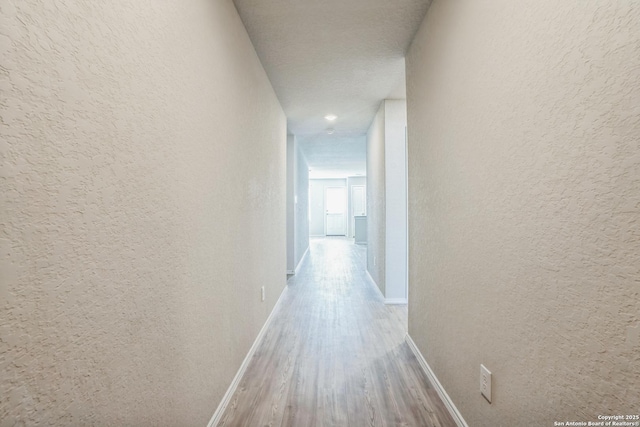 hallway featuring light hardwood / wood-style floors