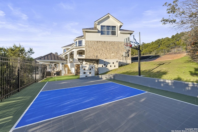 view of basketball court with a yard and a gazebo