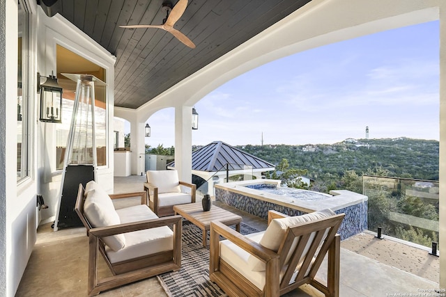 view of patio / terrace featuring ceiling fan, outdoor lounge area, and exterior kitchen