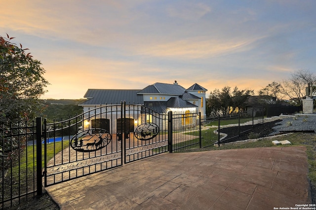 view of gate at dusk