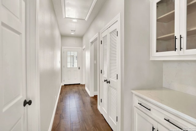 doorway with dark hardwood / wood-style flooring