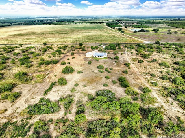 birds eye view of property with a rural view