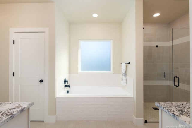 bathroom with vanity, tile patterned flooring, and independent shower and bath