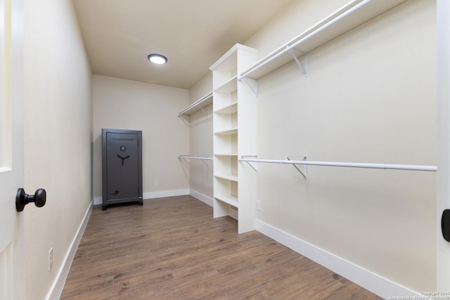 walk in closet featuring hardwood / wood-style floors