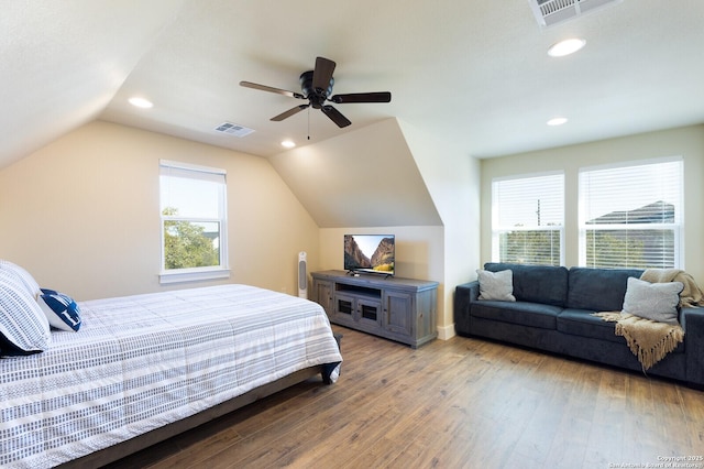 bedroom featuring wood-type flooring, lofted ceiling, and ceiling fan