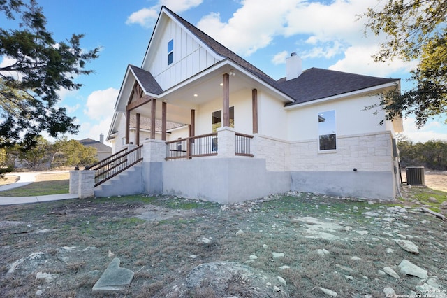 view of side of home featuring a yard and cooling unit