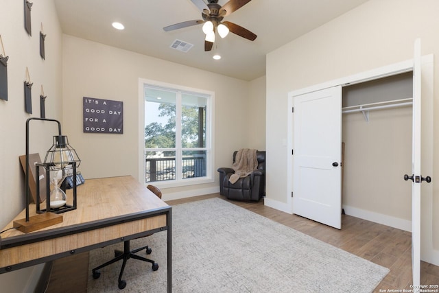 office area with hardwood / wood-style flooring and ceiling fan