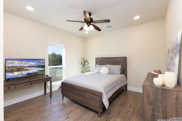 bedroom with ceiling fan and dark hardwood / wood-style flooring