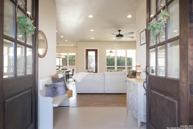 entryway featuring ceiling fan and plenty of natural light