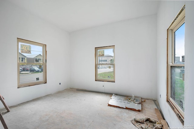 unfurnished room featuring plenty of natural light