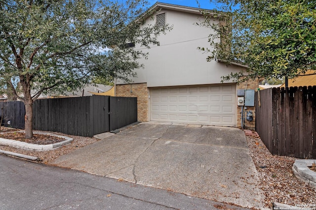 view of side of property with a garage