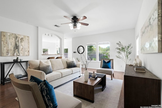 living room with hardwood / wood-style flooring and ceiling fan