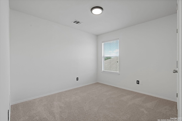 unfurnished room with light carpet