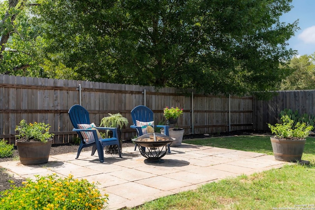 view of patio / terrace with an outdoor fire pit