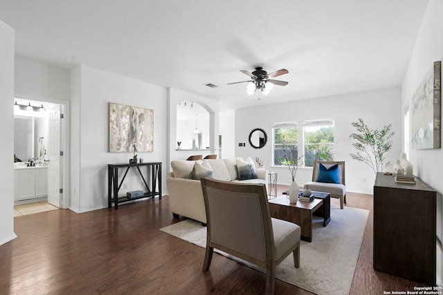 living room with ceiling fan and wood-type flooring