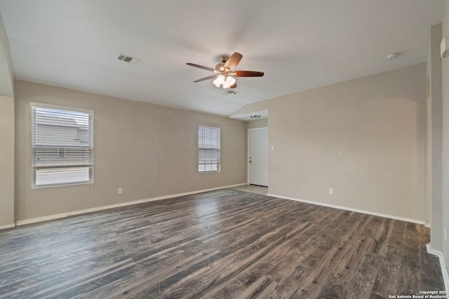 unfurnished room featuring vaulted ceiling, dark wood-type flooring, and ceiling fan